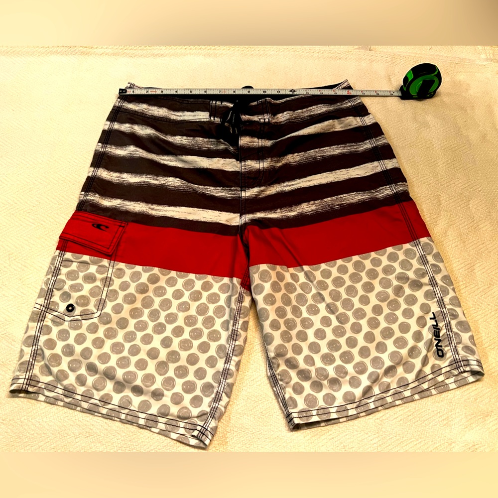 O’Neill  gray, red and black used board shorts in great condition size 32